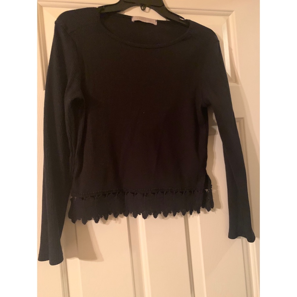 Black shirt with leaf details on bottom